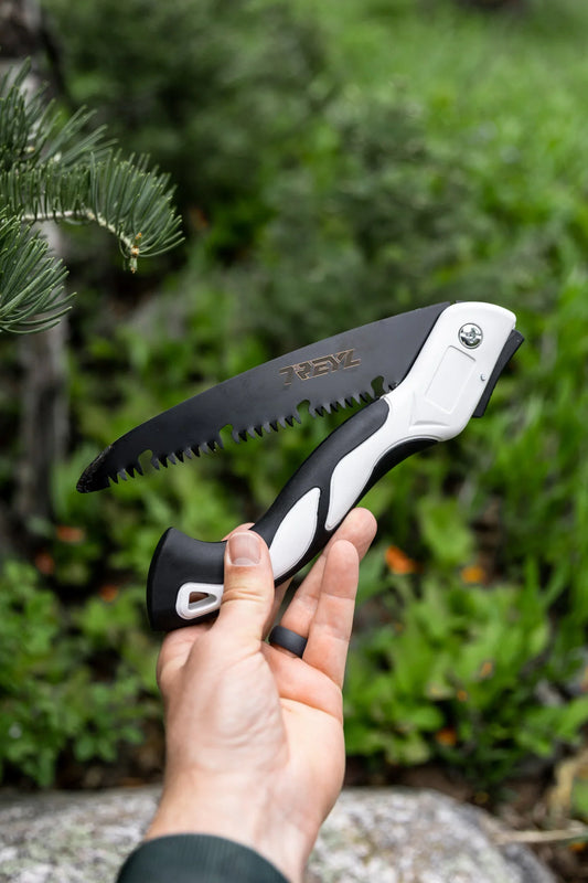 best folding saw for survival, featuring the Grizzly Backcountry Folding Saw in the backcountry